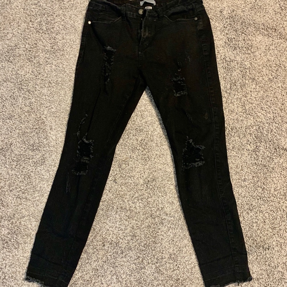 Black distressed jeans.